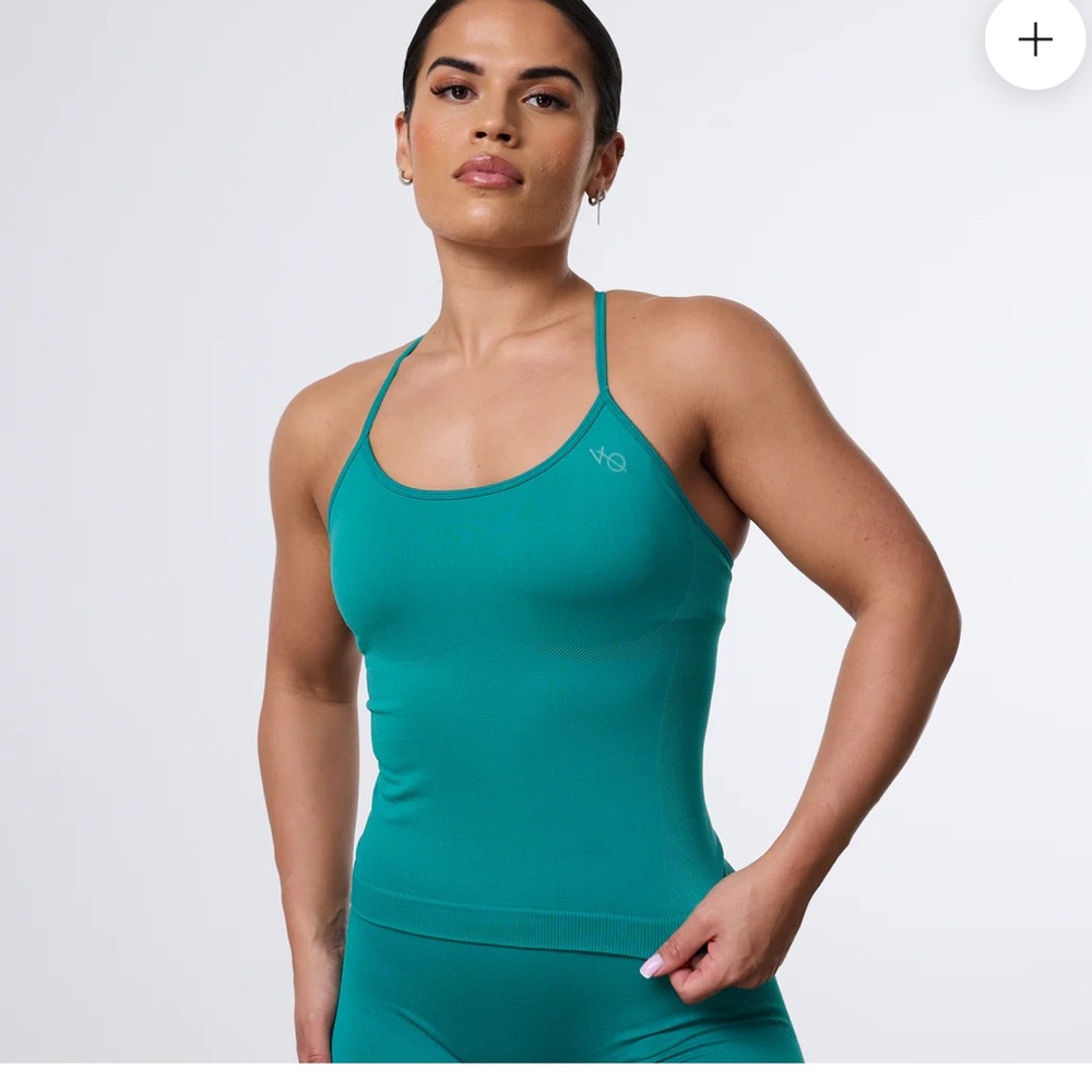 Two tops!!
Teal Vanquish Elevated Seamless Vest(tank) and Sports  Bra